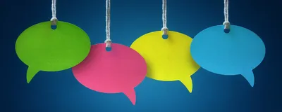 Four colorful speech bubbles hang in front of a blue background.