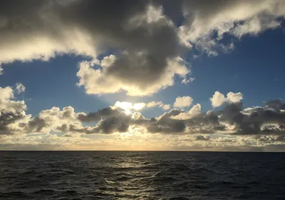 A view of the open ocean as the sun begins to set near Easter Island.