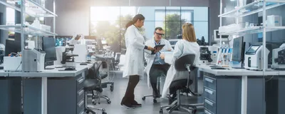 Image of two women and one man in a research laboratory.