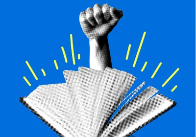 A hand in a fist comes out of an open book against a bright blue background.