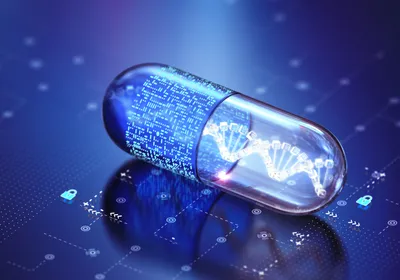 A pill is shown on a blue technical background. One half of the pill has a DNA helix on it, and the other half has a depiction of a computer chip, representing the role of artificial intelligence in drug development.