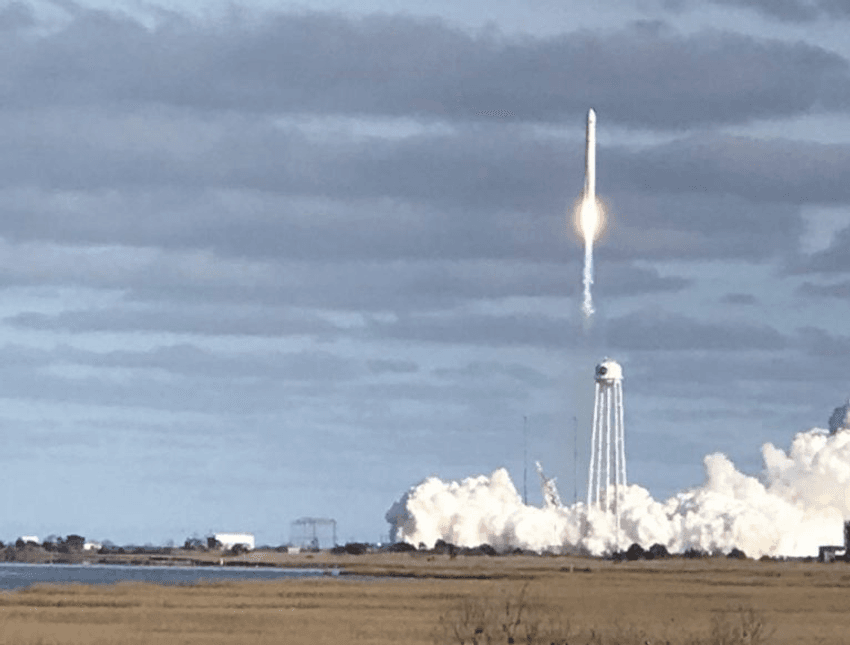 A rocket launching into space. Scientists sent bacteriophage and bacteria to study their dynamics under microgravity.