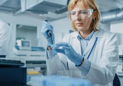 A scientist analyzing samples in droplet digital PCR system to achieve high precision quantification