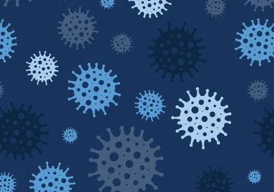 An illustration of differently colored viral particles on a dark background.