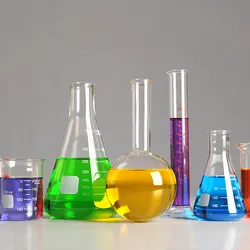 A photograph of laboratory glassware filled with colorful solutions.
