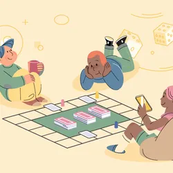 Children sitting on floor and playing together. The Gene Game is a biology-themed educational card game.