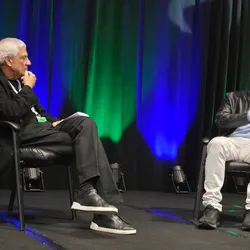 Greg Brockman of OpenAI and Vinod Khosla of Khosla Ventures sit together on stage during a fireside chat at the Precision Medicine World Conference 2026.