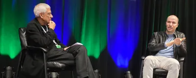 Greg Brockman of OpenAI and Vinod Khosla of Khosla Ventures sit together on stage during a fireside chat at the Precision Medicine World Conference 2026.