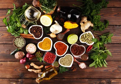 Spices on a table arranged in the shape of a heart, signifying the MASALA study which investigates South Asian population’s risk factors for cardiometabolic disease.