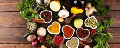 Spices on a table arranged in the shape of a heart, signifying the MASALA study which investigates South Asian population’s risk factors for cardiometabolic disease. 