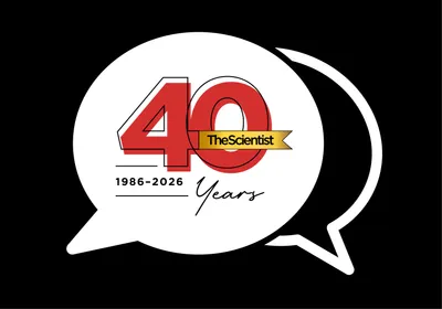 Image of two speech bubbles. Inside the full white speech bubble, there is red text denoting The Scientist 40 Years, 1986-2026.