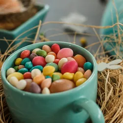 Easter candies sit in a bowl decorated for Easter.