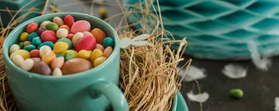 Easter candies sit in a bowl decorated for Easter.