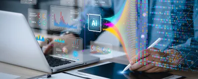Image of a person working on a computer and a tablet. There is an overlay of AI images and data floating in the air in front of the person.