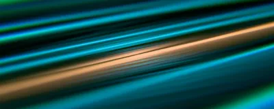 Abstract image of blue, green, and orange lines on a black background. 