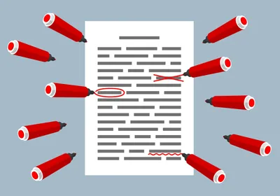 A document has red corrections on it, indicating retraction notices or expressions of concern, with red pens surrounding it.