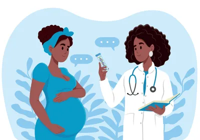 A pregnant woman is talking to a doctor.