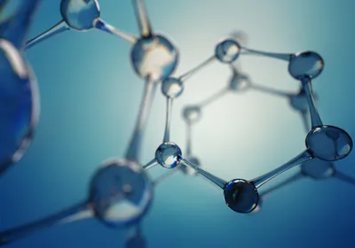 Glass balls form chemical rings, representing the complicated and ring structures of macrocyclic peptides.