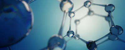 Glass balls form chemical rings, representing the complicated and ring structures of macrocyclic peptides.