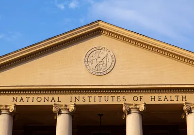 The main historic building of the National Institutes of Health is shown.