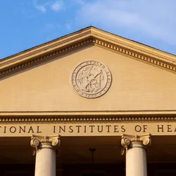 The main historic building of the National Institutes of Health is shown.