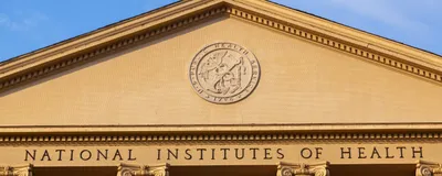 The main historic building of the National Institutes of Health is shown.