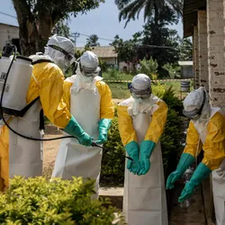 Members of the Ebola response team, Médecins Sans Frontières, disinfect their gloves as they respond to the Ebola outbreak in the Democratic Republic of the Congo in May 2026.