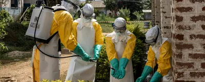 Members of the Ebola response team, Médecins Sans Frontières, disinfect their gloves as they respond to the Ebola outbreak in the Democratic Republic of the Congo in May 2026.