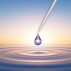 Conceptual image of a water drop released from a pipette tip, with a rippling pool of water below.