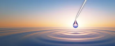 Conceptual image of a water drop released from a pipette tip, with a rippling pool of water below.