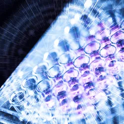 Cell culture wells viewed through a blue and purple digital network overlay, suggesting AI-guided protein engineering.