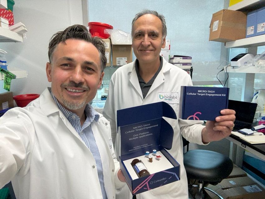 A photo of Elmar Nurmemmedov, the chief executive officer and co-founder of CellarisBio (Left), and Ivan Babic, the chief scientific officer and co-founder of CellarisBio (Right), displaying the newly released MICRO-TAG® Real-Time Cell Target Engagement Kit.   Credit: Elmar Nurmemmedov