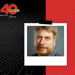 Frank Bradke wears a black shirt smiles at the camera in the TS 40th anniversary template.