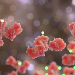 Stylized 3D rendering of antibody-drug conjugate molecules with glowing payload particles