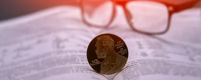 Nobel prize medal on an open book, indicating the super-resolution microscopy Nobel prize.