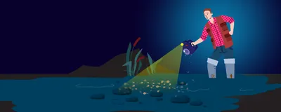 A man wearing knee-high boots stands in ankle-deep, muddy water at night, holding a wet camera. Dense brine shrimp in the shallow water obscure the thrombolites on the lakebed.