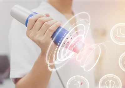 Physiotherapist using shockwave with virtual health care symbol and pain icons medical on interface, signifying ultrasound-mediated cancer therapy.