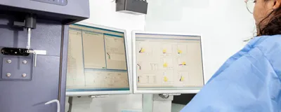 Scientist analyzing data from a flow cytometry experiment