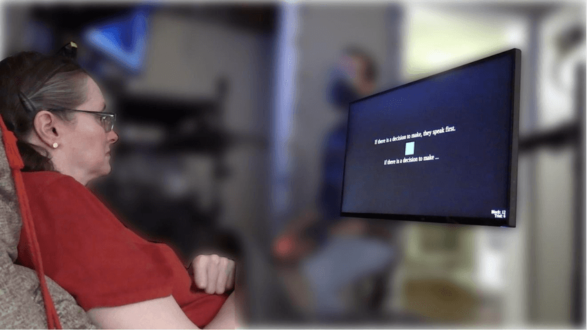 A person using a neuroprosthetic speech device to communicate. The machine decodes sentences imagined by the study participant in real time and displays it on the screen.
