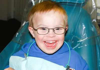 A young child with Down syndrome at the dentist.