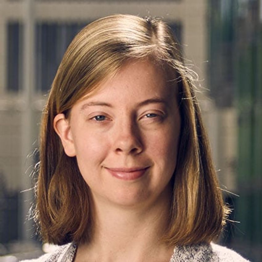 A photograph of Julia Belk, as she smiles at the camera. A photograph of Julia Belk, as she smiles at the camera.