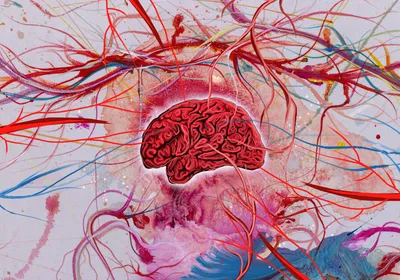 An illustration of a red-colored brain against a vivid and abstract background, with a few red and blue protrusions reaching out to the brain.