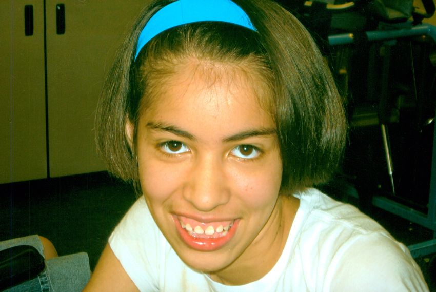 A picture of Savannah wearing a blue top and hairband. A picture of Savannah wearing a blue top and hairband.