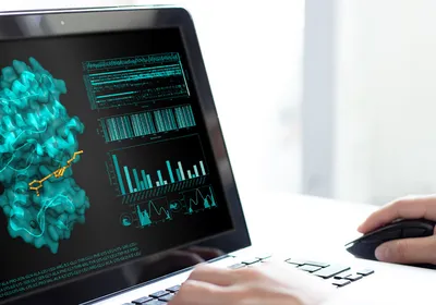 A scientist using computational tools to examine enzyme properties.