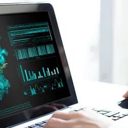 A scientist using computational tools to examine enzyme properties.