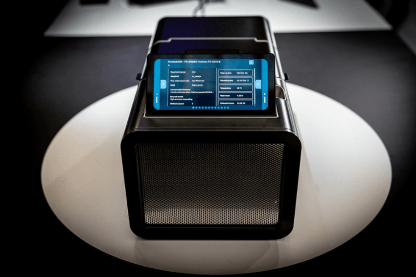 The PromethION 2 Integrated, a black benchtop sequencing instrument with an integrated touchscreen. The PromethION 2 Integrated, a black benchtop sequencing instrument with an integrated touchscreen.