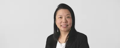 Image of Xiaowei Wang. She wears a black jacket over a white top.