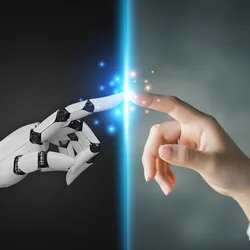 A robot finger and a human finger touch.
