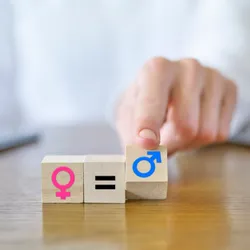 A finger moves blocks signifying symbols of female and male sexes. 