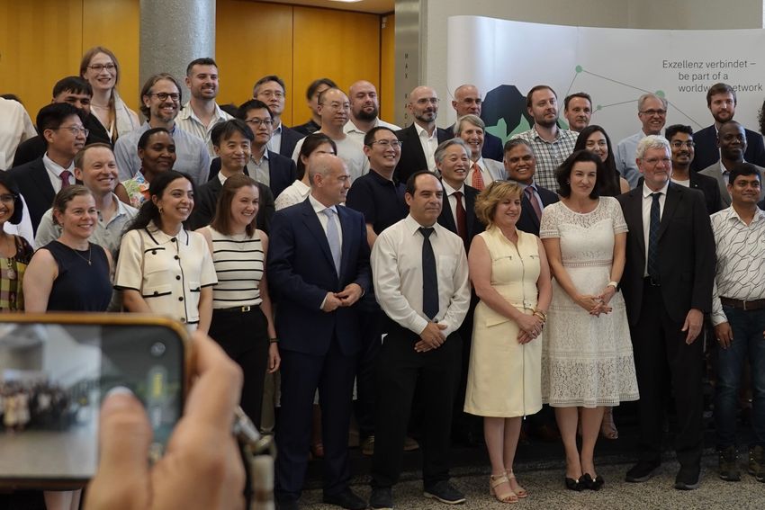 A group of people gather for a photo